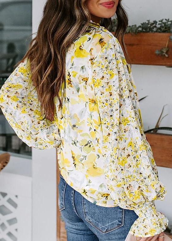 model wearing yellow floral blouse