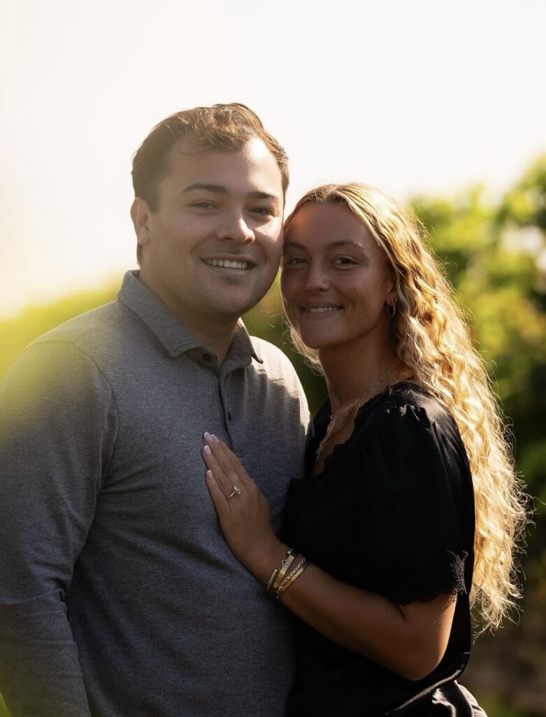 COUPLE POSING IN ENGAGEMENT PHOTO