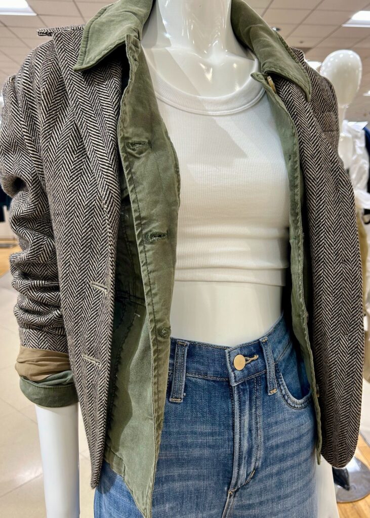 MODEL WEARING TWEED BLAZER LAYERED WITH WHITE TANK AND PAIRED WITH JEANS