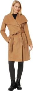 woman wearing camel wool coat with tie at waist